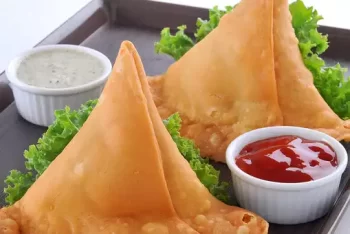 Crispy, golden-brown meat samosa from Let's Fry Away, priced at Ksh 50.